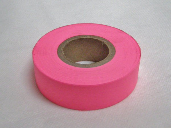 Fluorescent pink surveyors tape